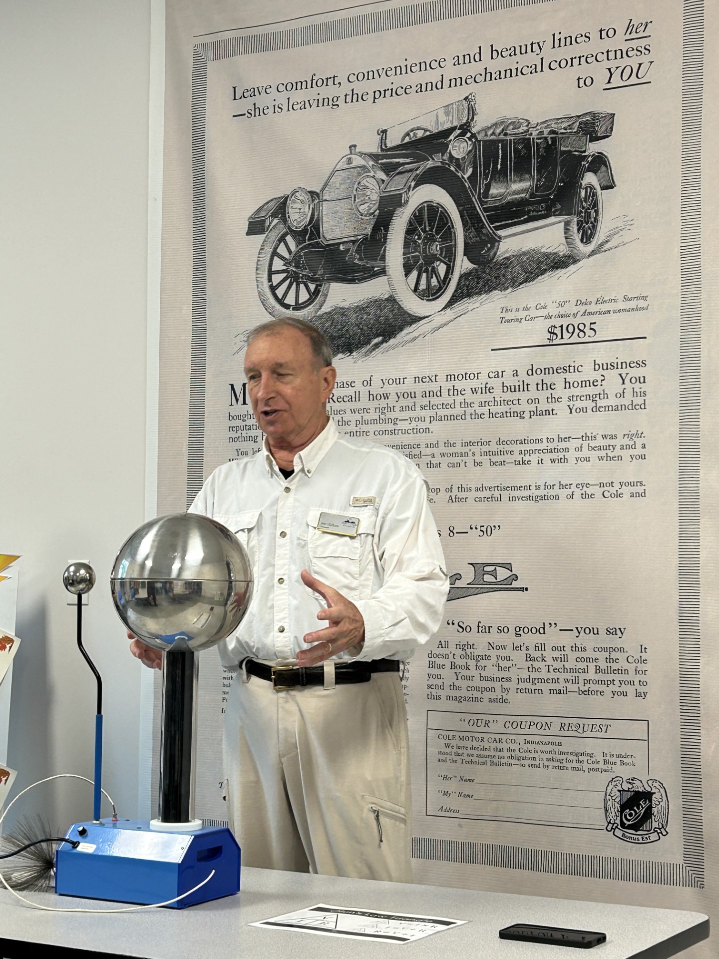 A person standing next to a ballDescription automatically generated